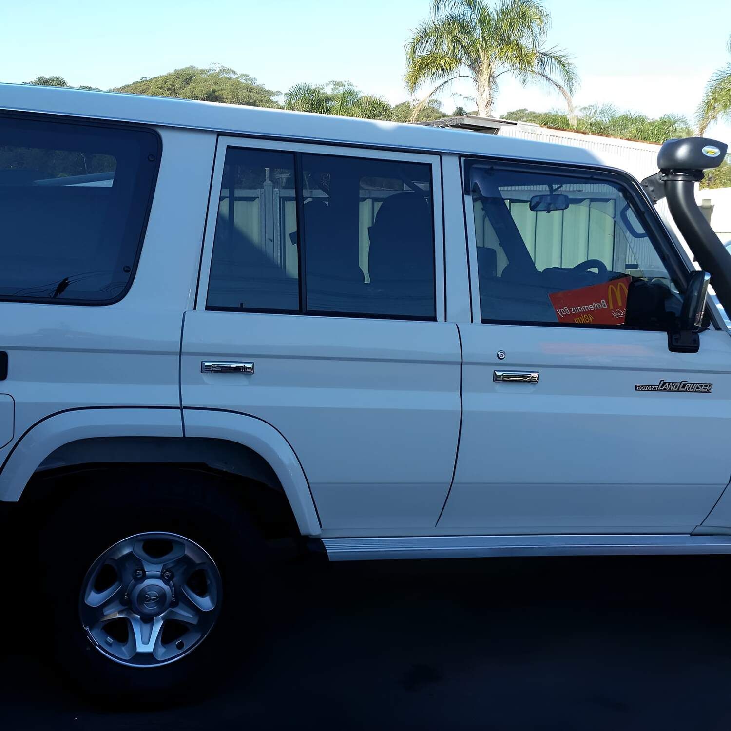 A White Suv With A Snorkel Is Parked In A Parking Lot — Solartint South Coast (Juz Tint) In Batemans Bay, NSW