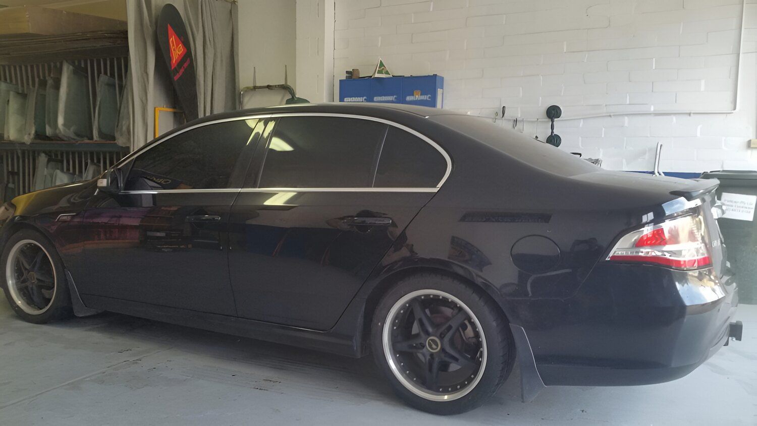 A Black Car Is Parked In A Garage โ Solartint South Coast (Juz Tint) In Batemans Bay, NSW