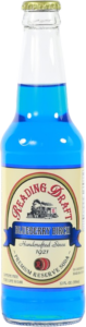 Glass bottle of bright blue soda with a white label and gold cap