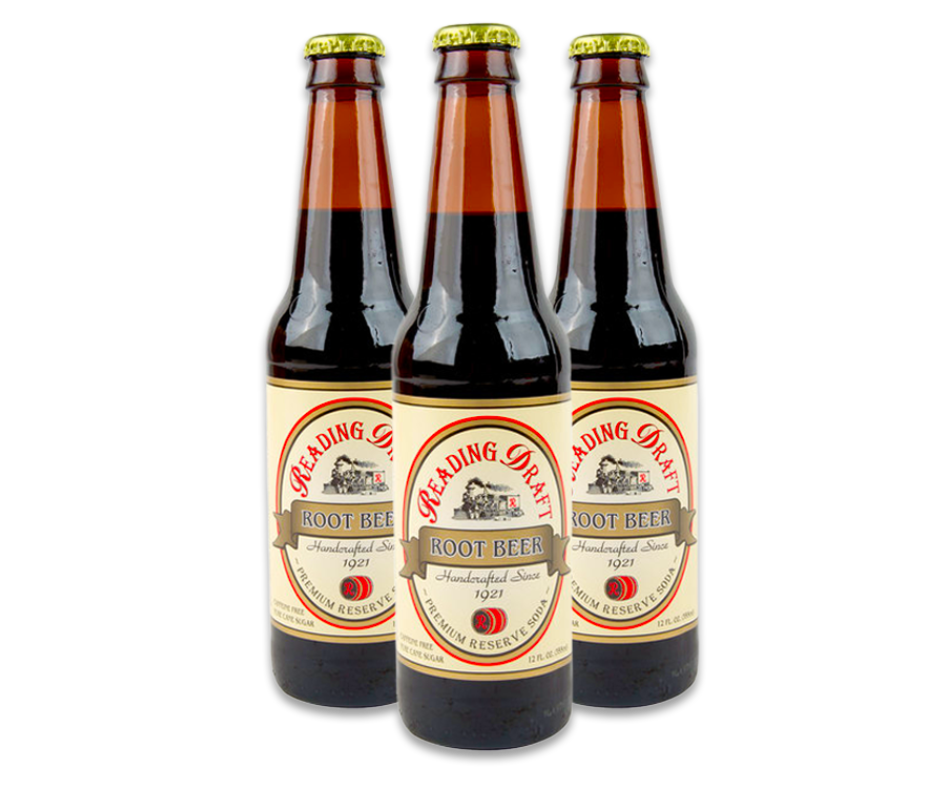 Three brown beer bottles with cream labels on a white background.