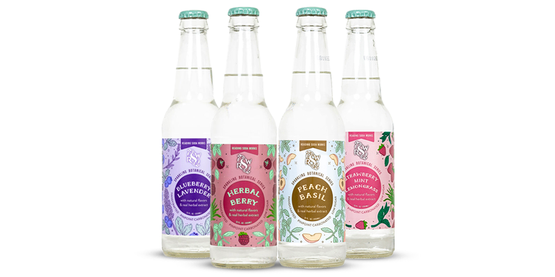 Four bottled drinks with pastel labels, including purple, pink, gold, and white designs.