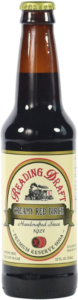 A brown glass bottle of Abita Brewing Company beer with a cream label and yellow cap