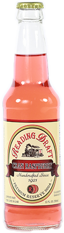 Glass bottle of pink grapefruit soda with a cream label and gold cap