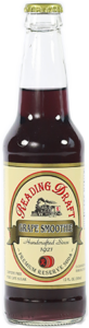 Glass bottle of dark red Granding's grape juice with a cream label and green cap