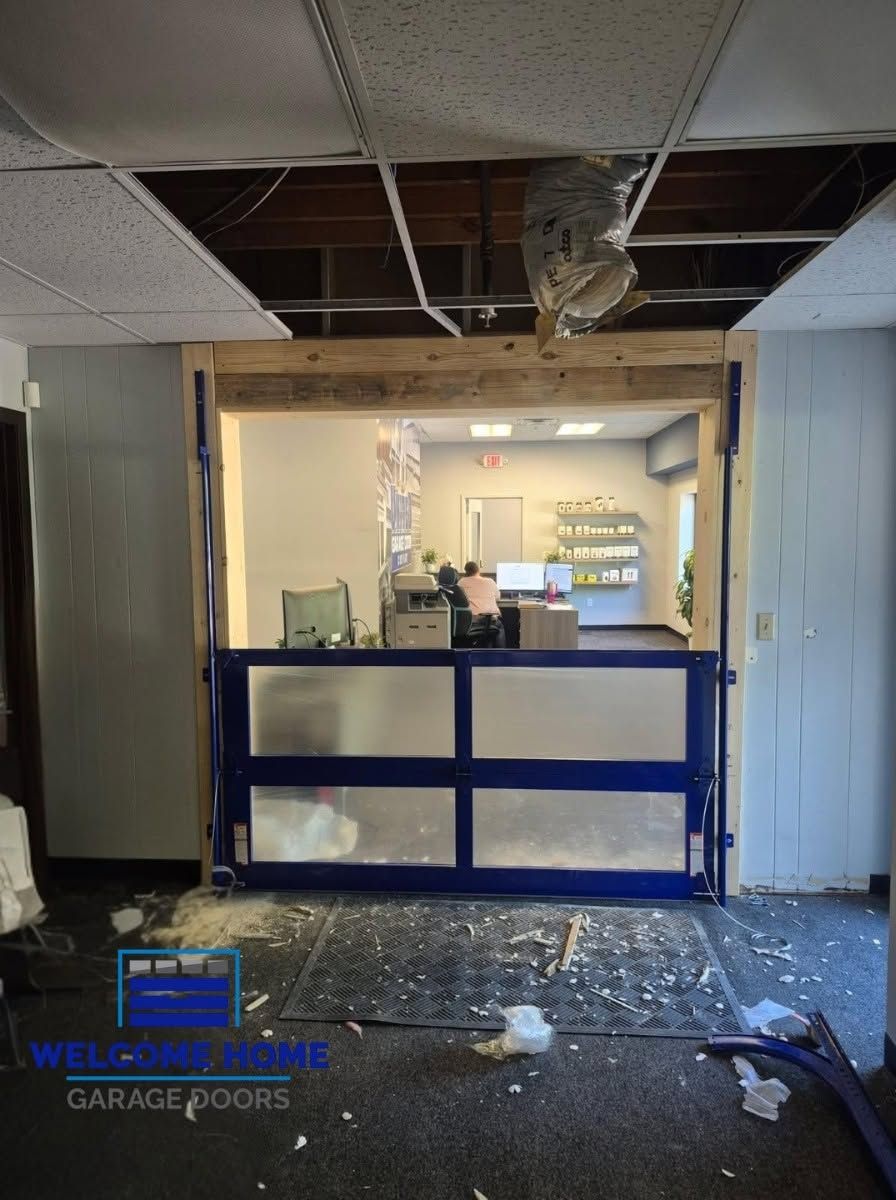 Damaged lobby with broken ceiling, debris on floor, and a blue front counter in a storefront interior.