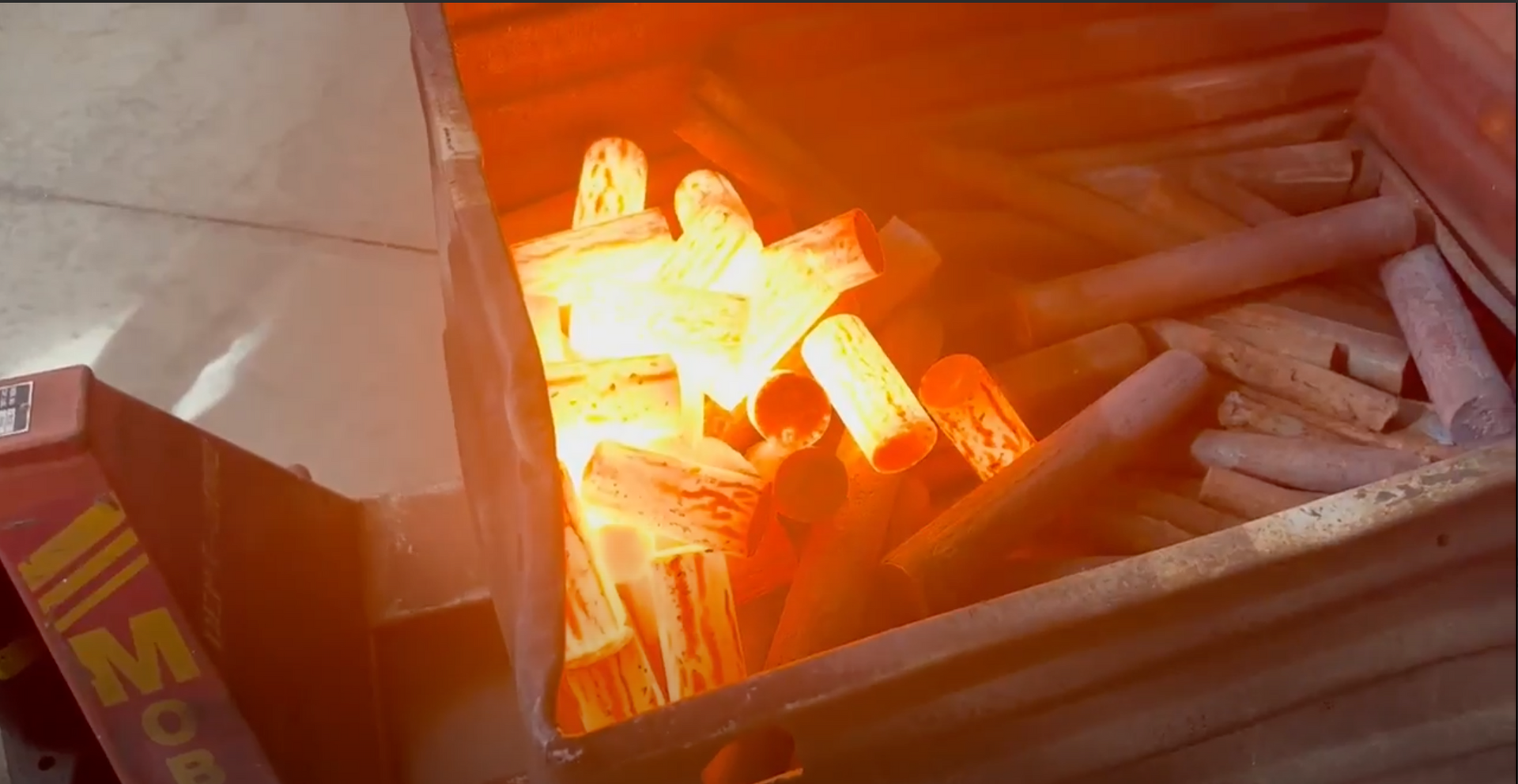 Image of hot metal billets heated through induction machinery by ESC Induction