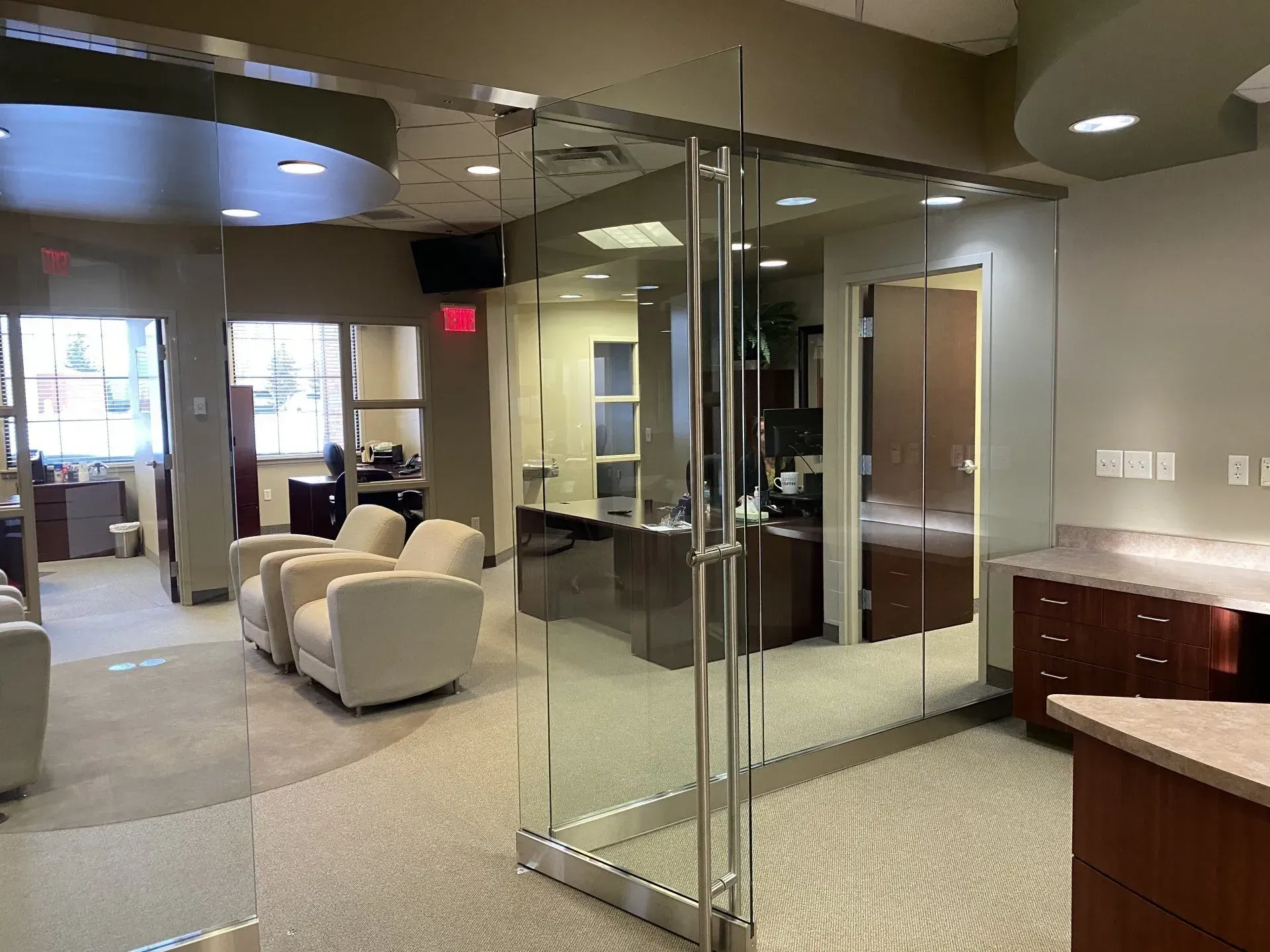 A large room with a lot of glass doors and walls.
