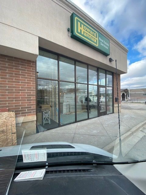 A storefront for Home & Haven, with large glass windows. Exterior view from a vehicle.