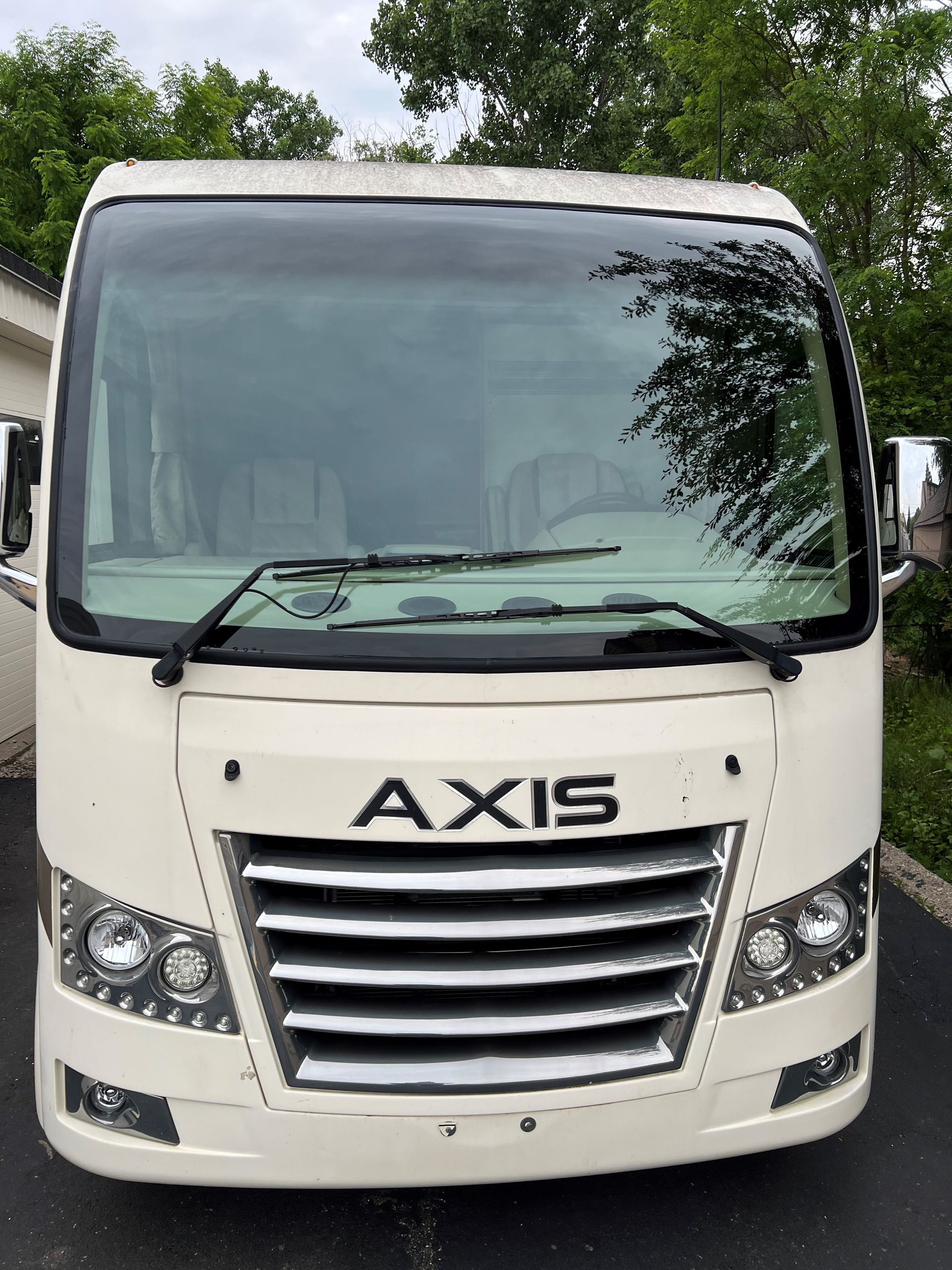 Cream-colored Thor Axis RV with 