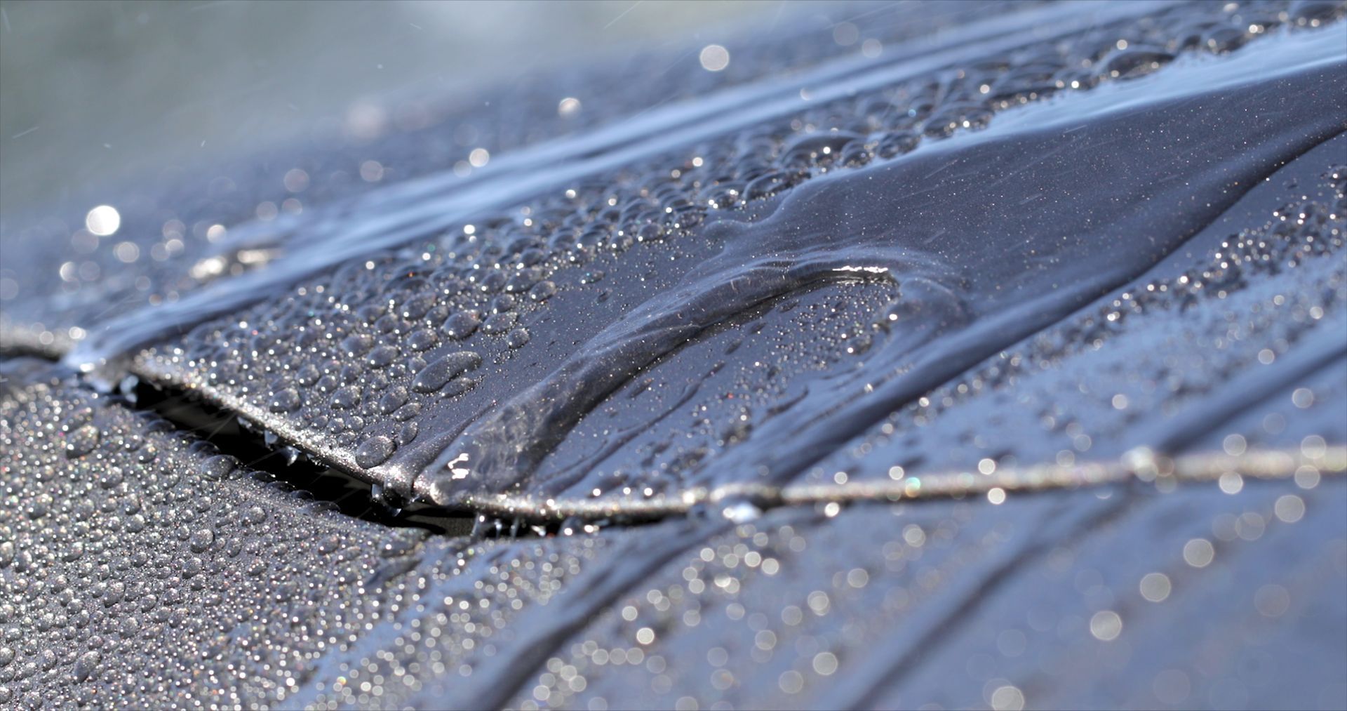 rain dripping off car protected coating