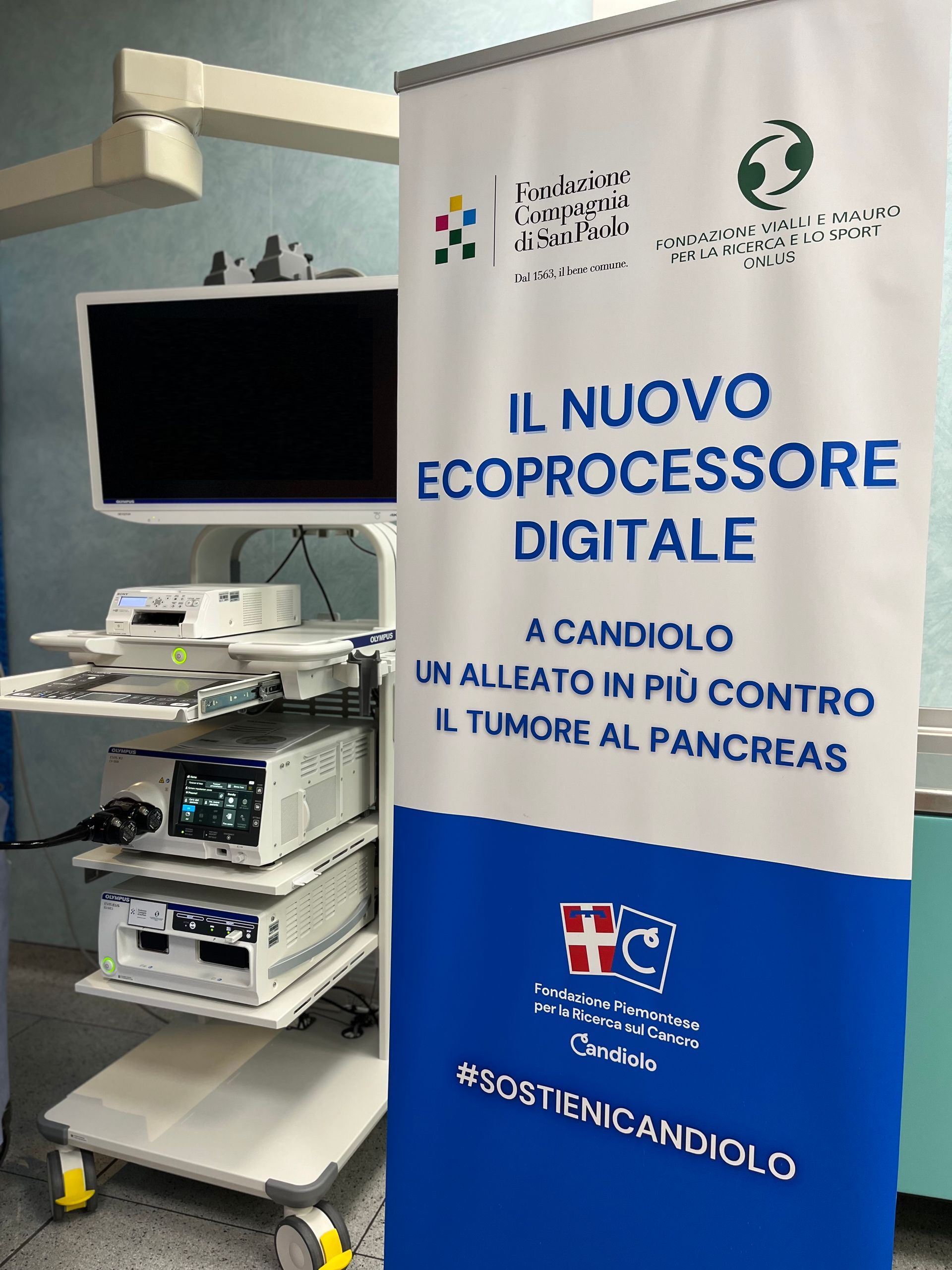 A banner in an operating room reads 