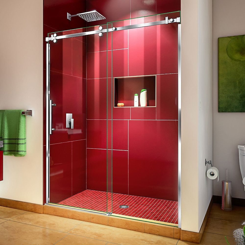 A modern walk-in shower with glass sliding doors, chrome hardware, and vibrant red tiled walls.