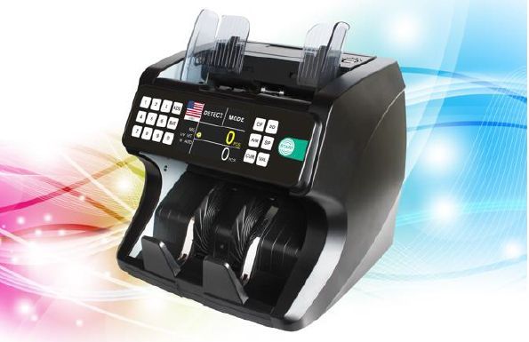 A money counting machine with a receipt on it