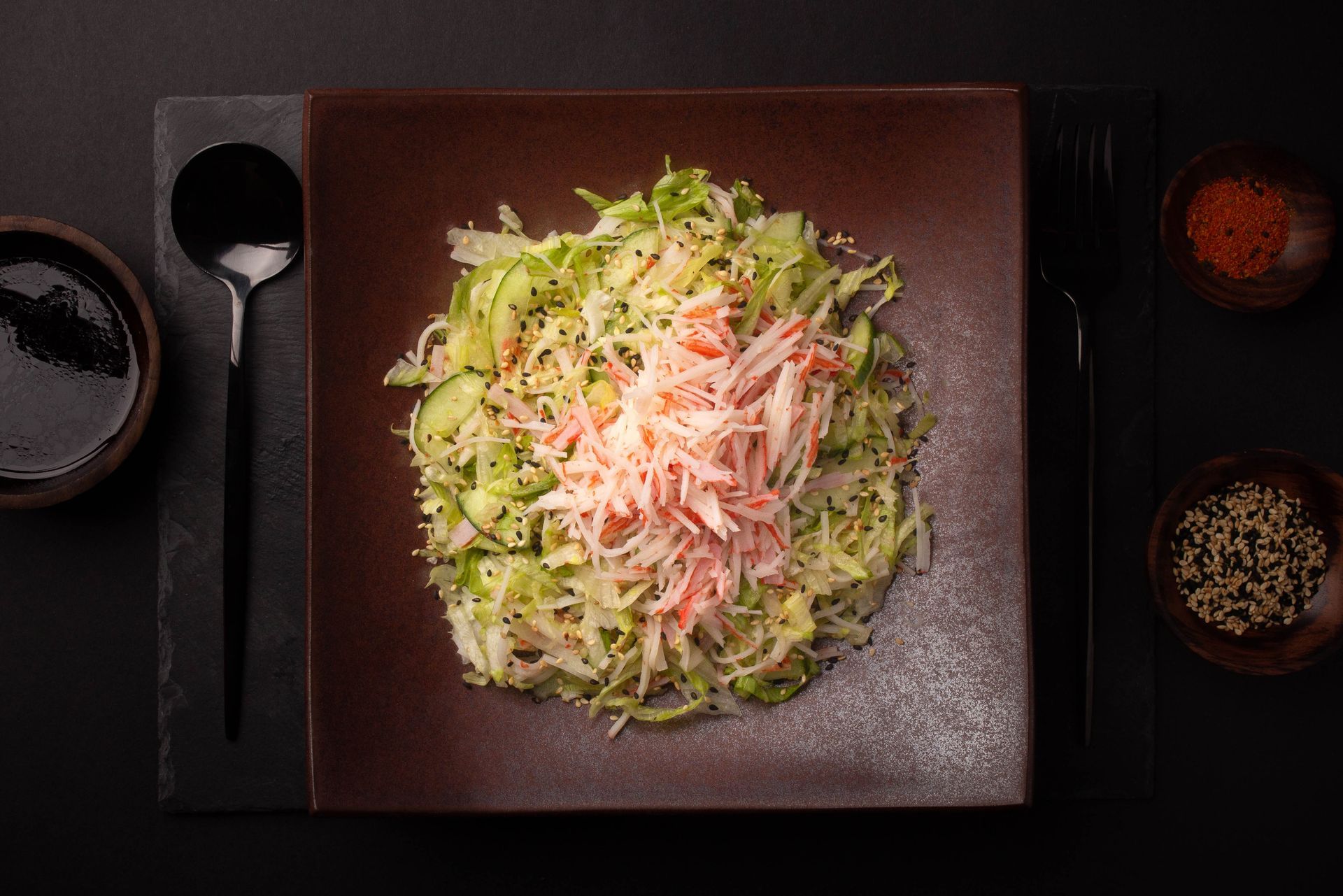 Sushi Restaurant | Finding Sushi | Top-down view of a plated salad with shredded vegetables 