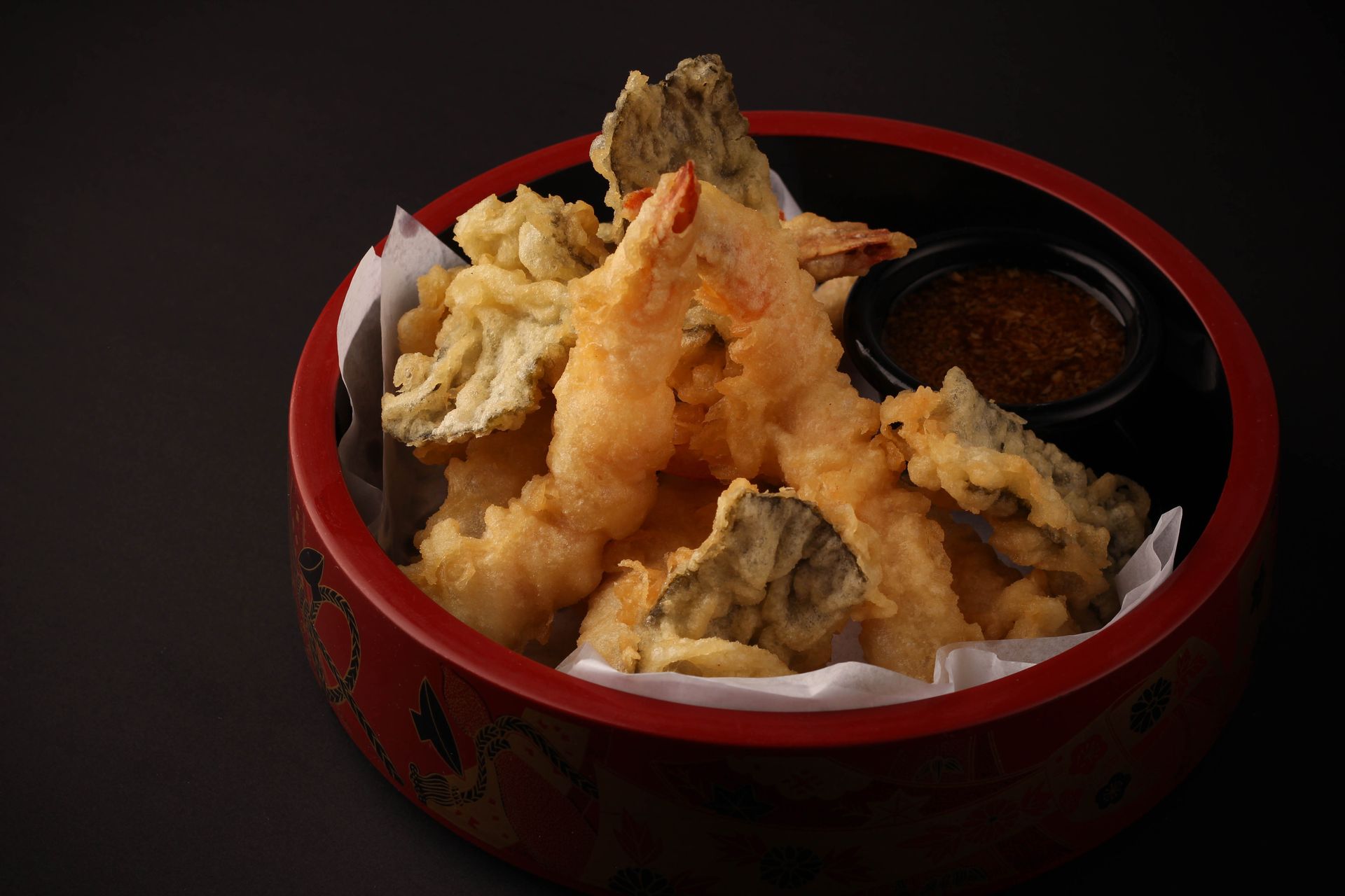 Sushi Restaurant | Finding Sushi | Bowl of assorted tempura with dipping sauce on a dark background