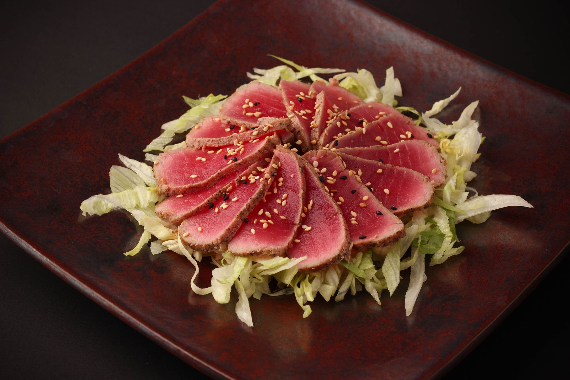 Sushi Restaurant | Finding Sushi | Artful sashimi rose on shredded cabbage, garnished 