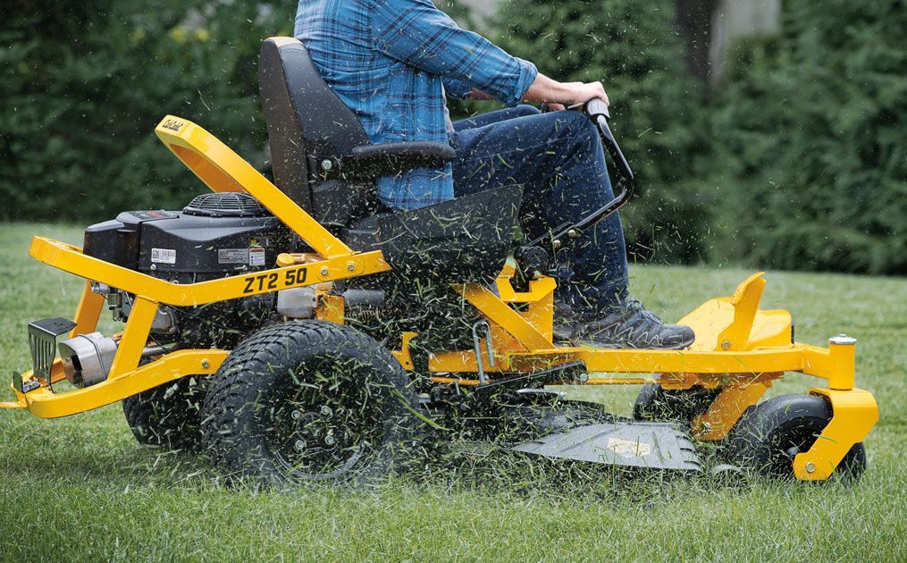 guy riding lawn mower