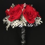 Red rose bouquet with white foliage on a black background
