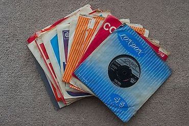 A bunch of records are stacked on top of each other