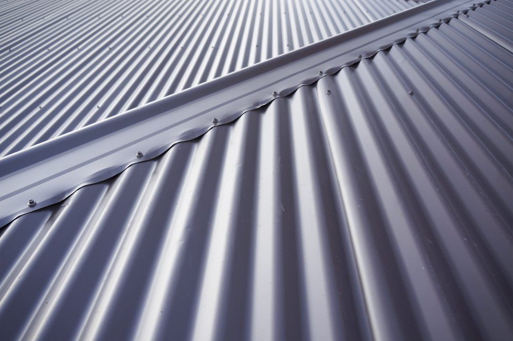 A Close Up of a Metal Roof With a Diagonal Pattern — Goulburn Roofing In Canberra, NSW