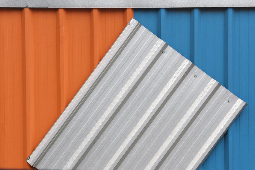 A Close Up of a Blue and Orange Metal Roof — Goulburn Roofing In Goulburn, NSW