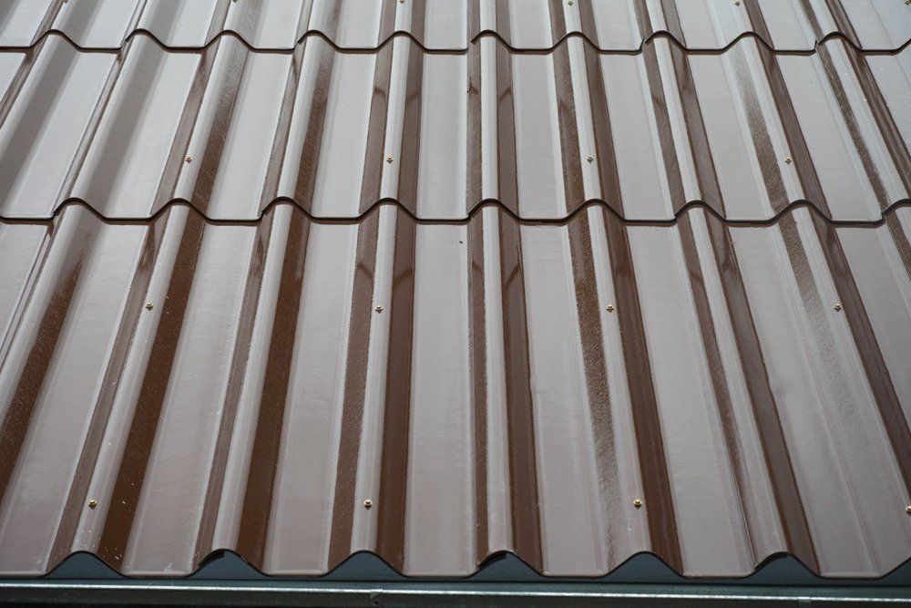 A Close Up of a Brown Corrugated Metal Roof — Goulburn Roofing In Goulburn, NSW