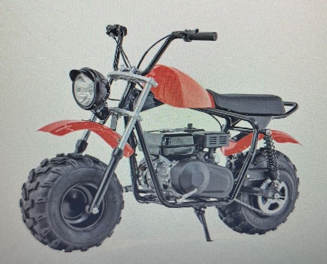 Red mini dirt bike with fat tires, round headlight, and black seat on a white background