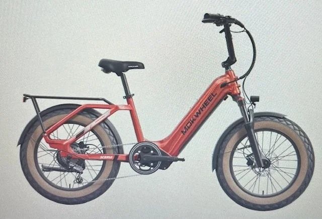 Red folding electric bike with rear rack, fat tires, and black handlebars on a plain background