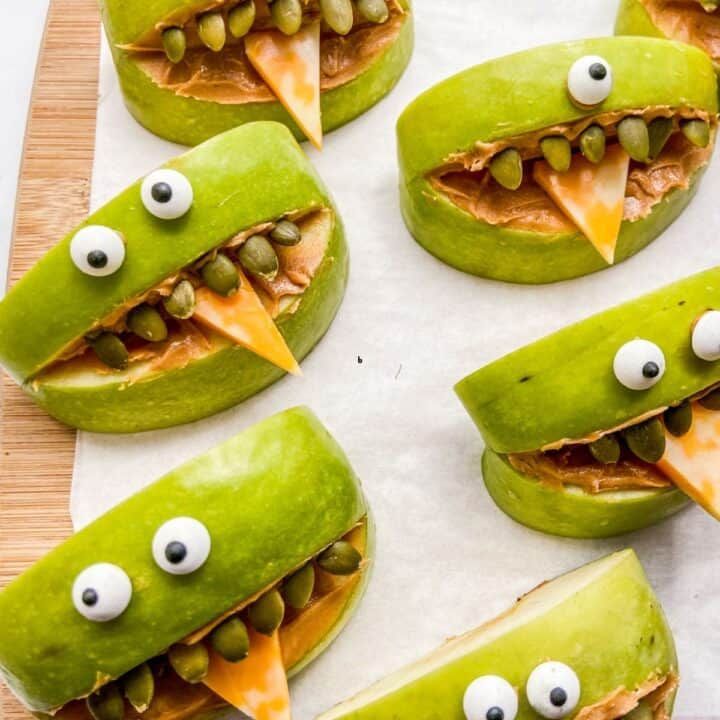 A bunch of green apples that look like monsters