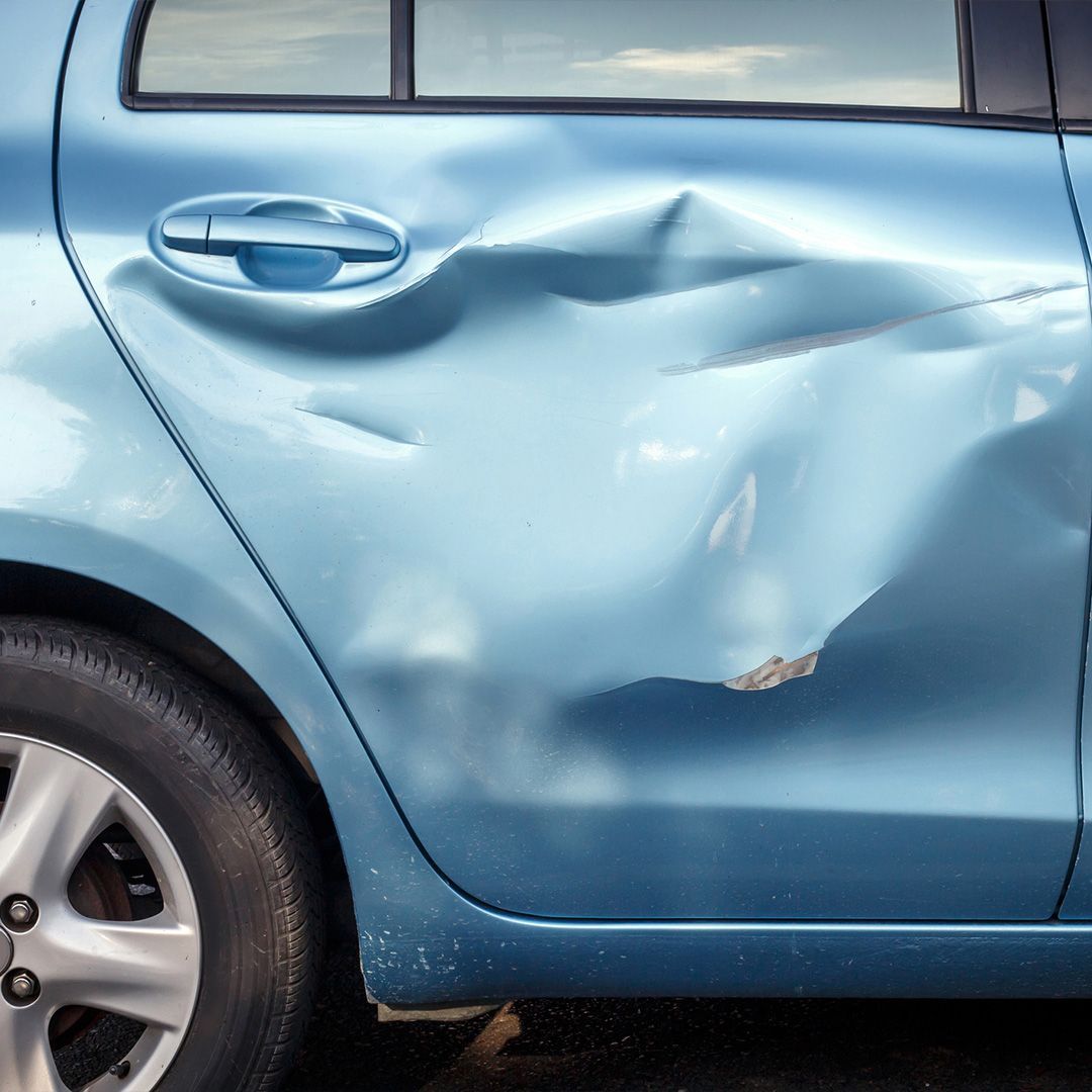 blue car dented and damaged