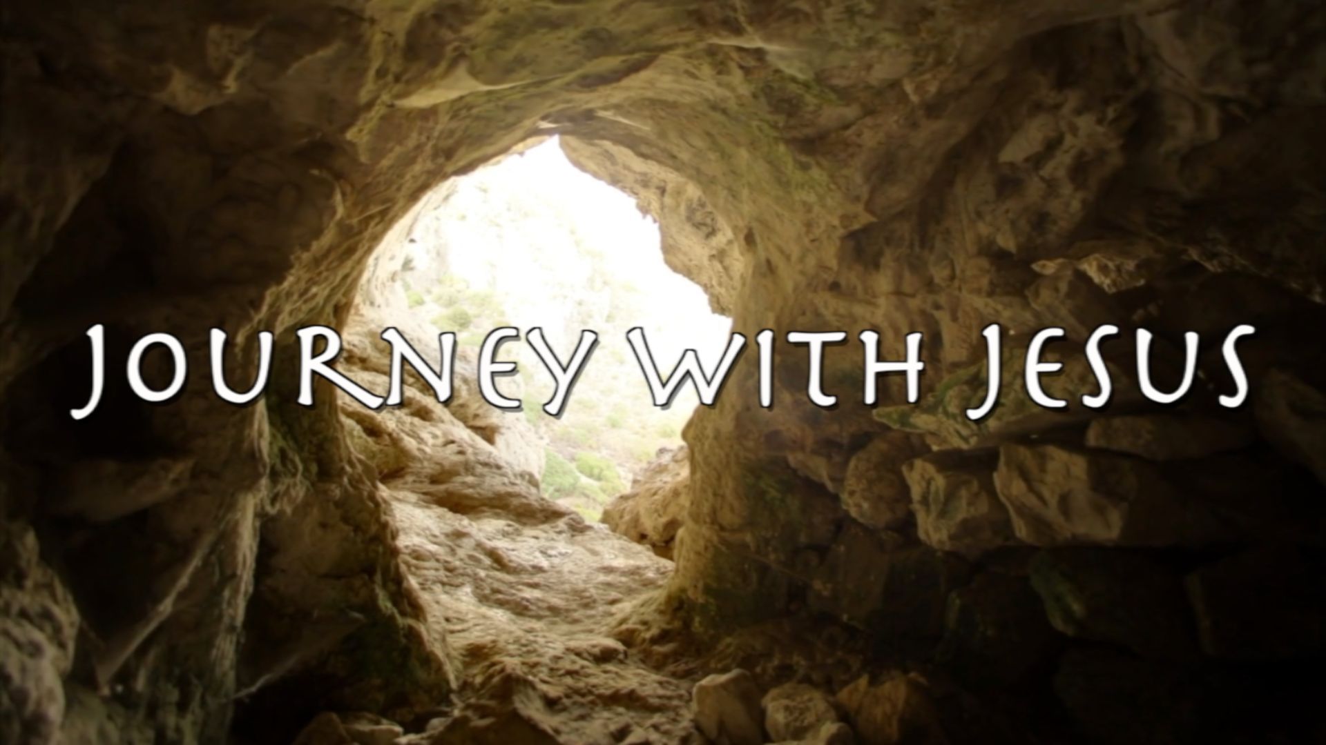 A cave with the words `` journey with jesus '' written on it.