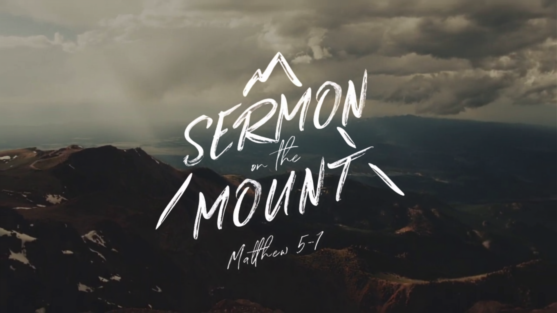 Mountain landscape under cloudy sky with overlaid “Sermon Mount” title text