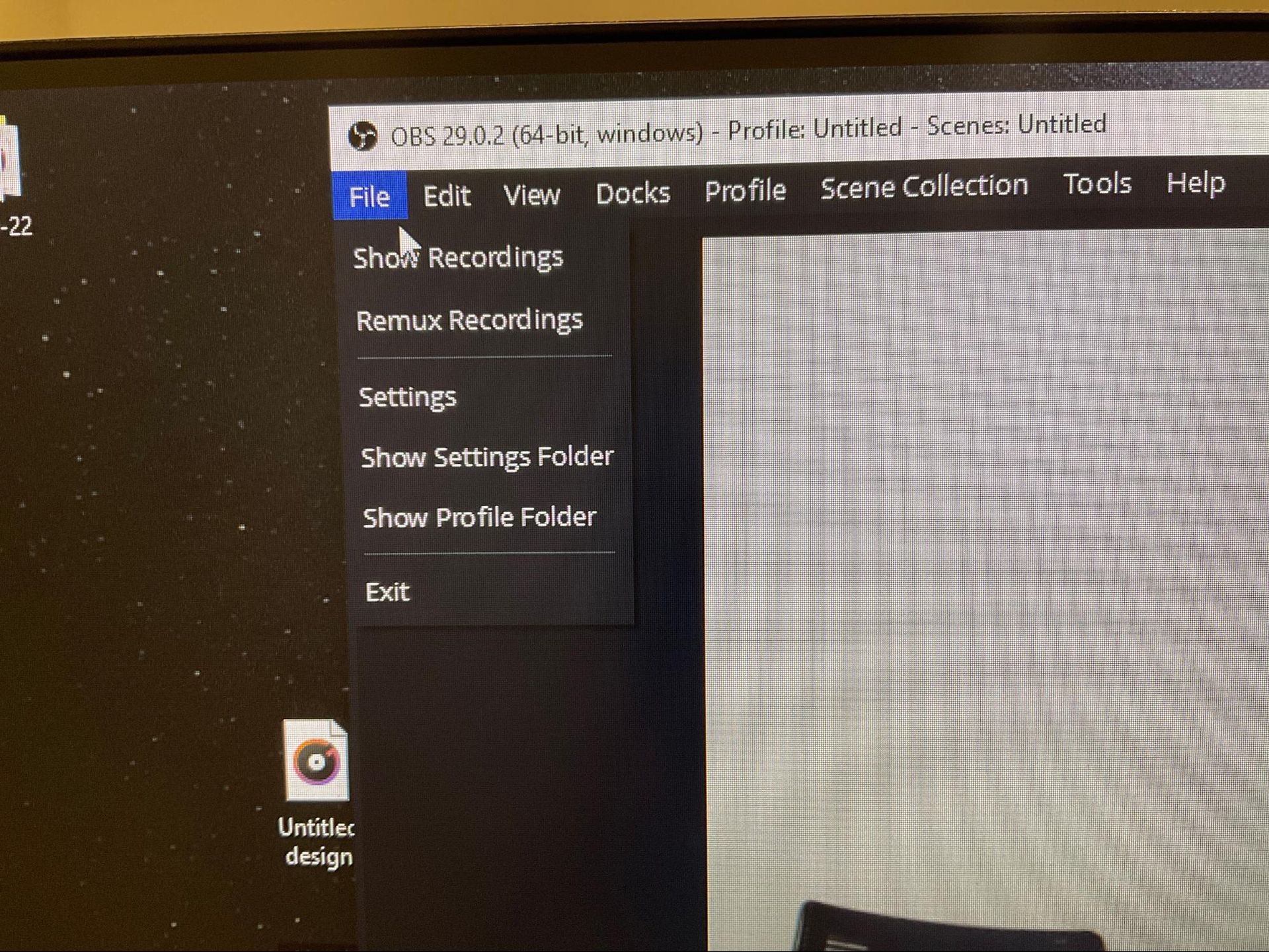 OBS Studio menu open on a laptop screen with options like Start Recording and Settings visible.