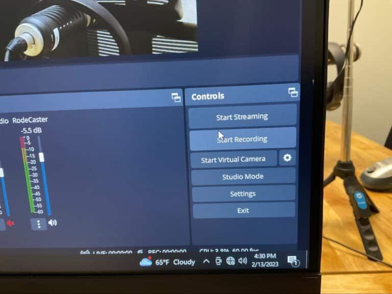 Computer monitor showing a streaming control panel with start streaming, recording, virtual camera and studio mode,
