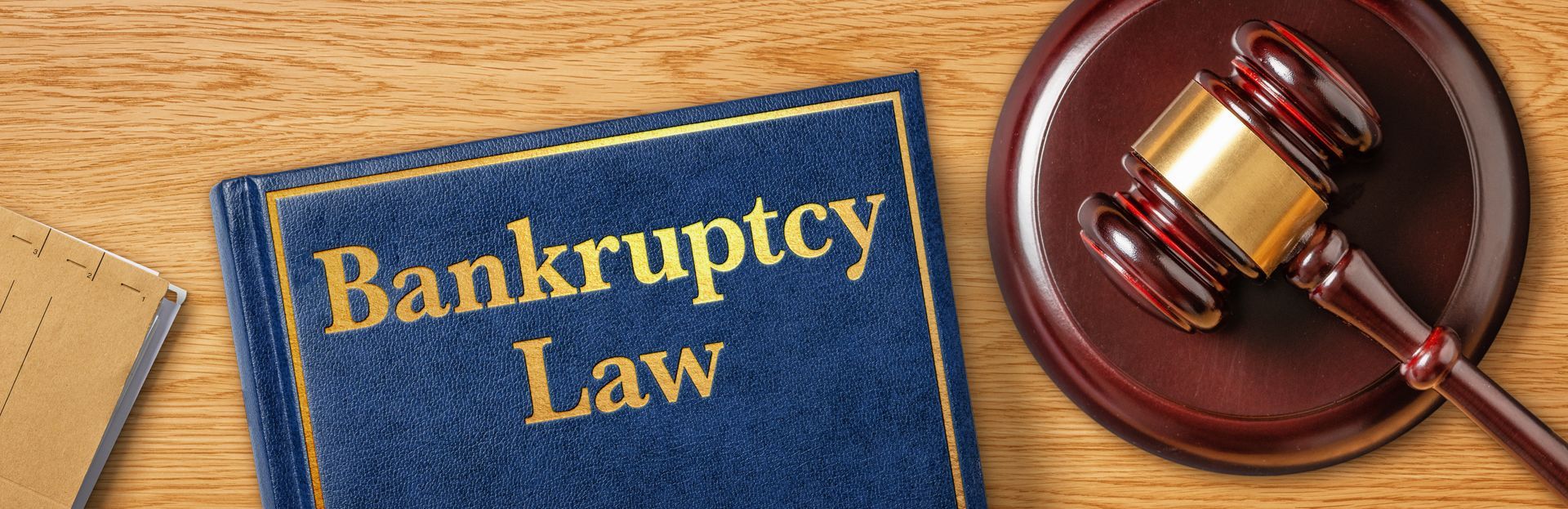 Bankruptcy Law book topped with gavel.