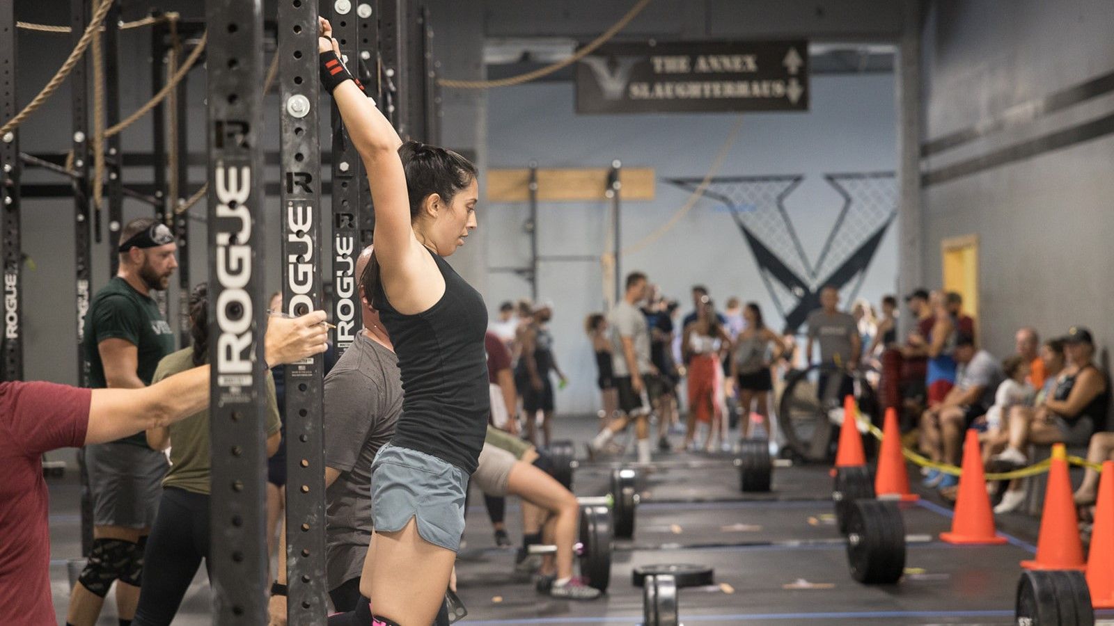 A group of people are lifting weights as part of a CrossFit competition near Scranton, PA