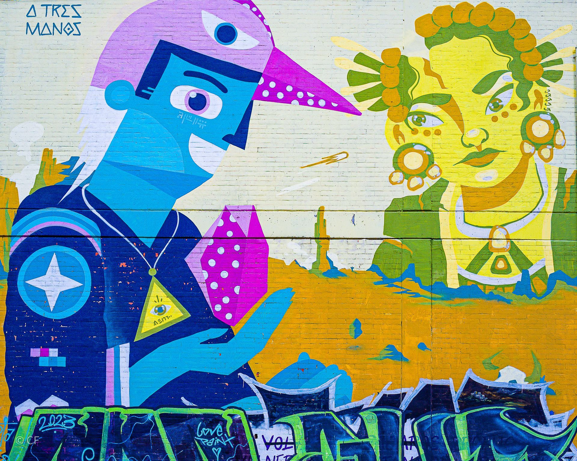 Graffiti on a wall that says tres vamos