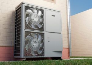 Outdoor HVAC heat pump unit beside a building wall, with two visible fans and metal casing