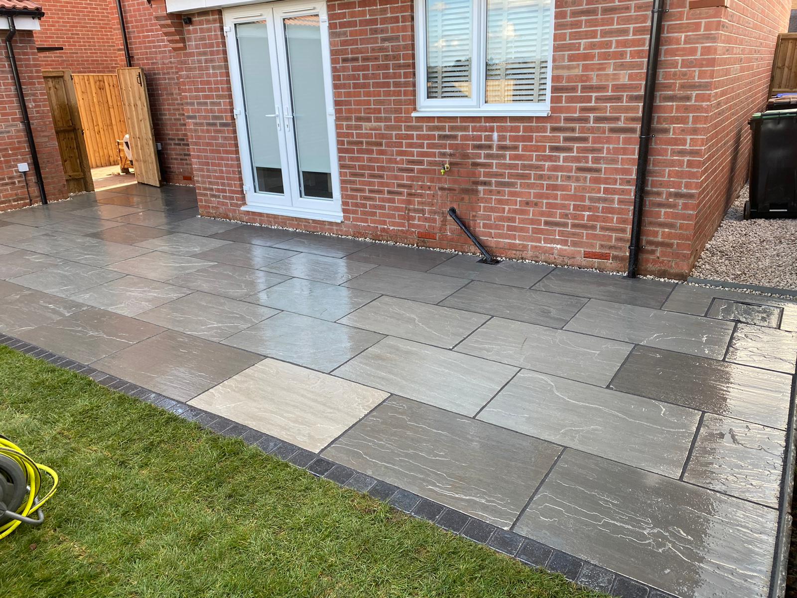 grey paving to provide a back garden patio