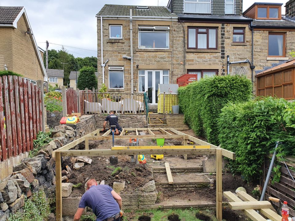 Our installer building the frame for a raised deck on a sloping Cardiff garden