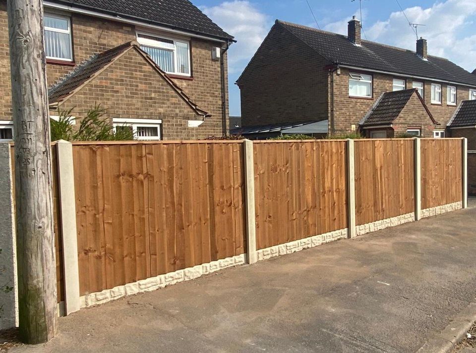 Closeboard fence on concrete posts and gravel boards along a pavement in Cardiff