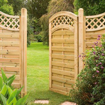 A discrete wooden trellis gate in a Cardiff garden