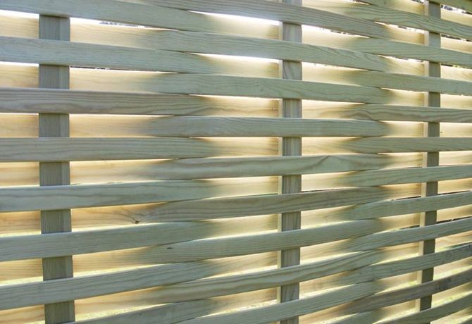 Close-up of a woven timber fence panel