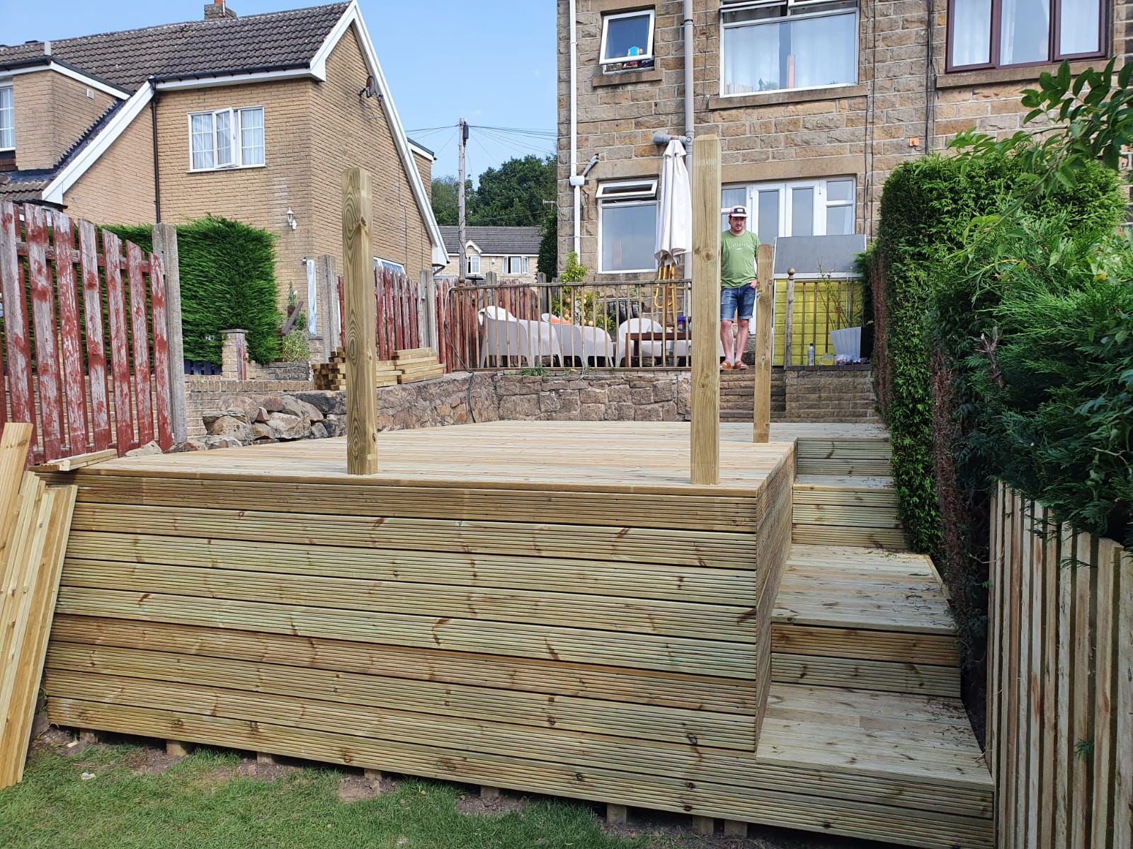 Raised wooden decking being constructed in a Barry back garden