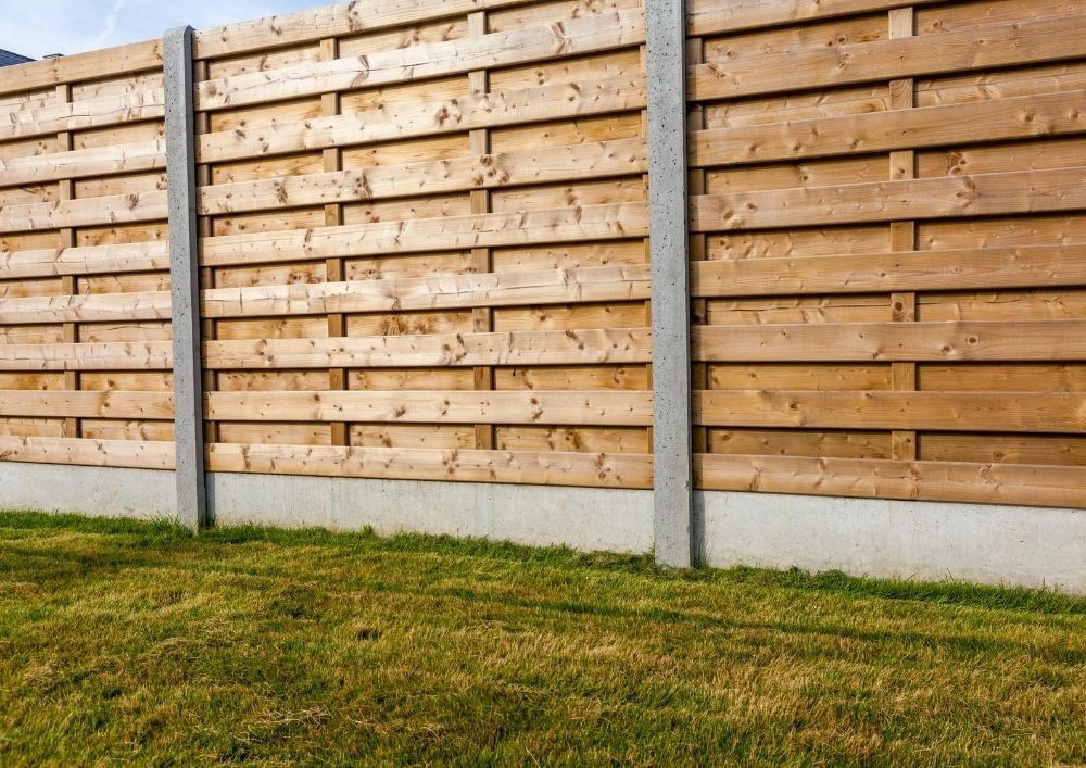 Hit and miss fencing with concrete posts and gravel board in Cardiff garden