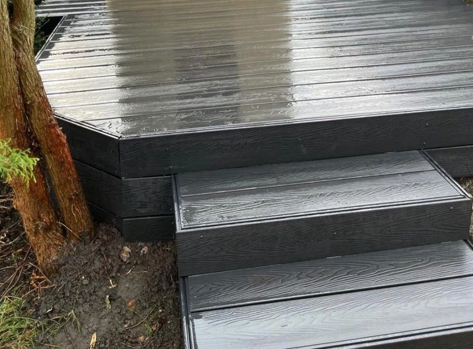 Grey composite deck with two built-in steps