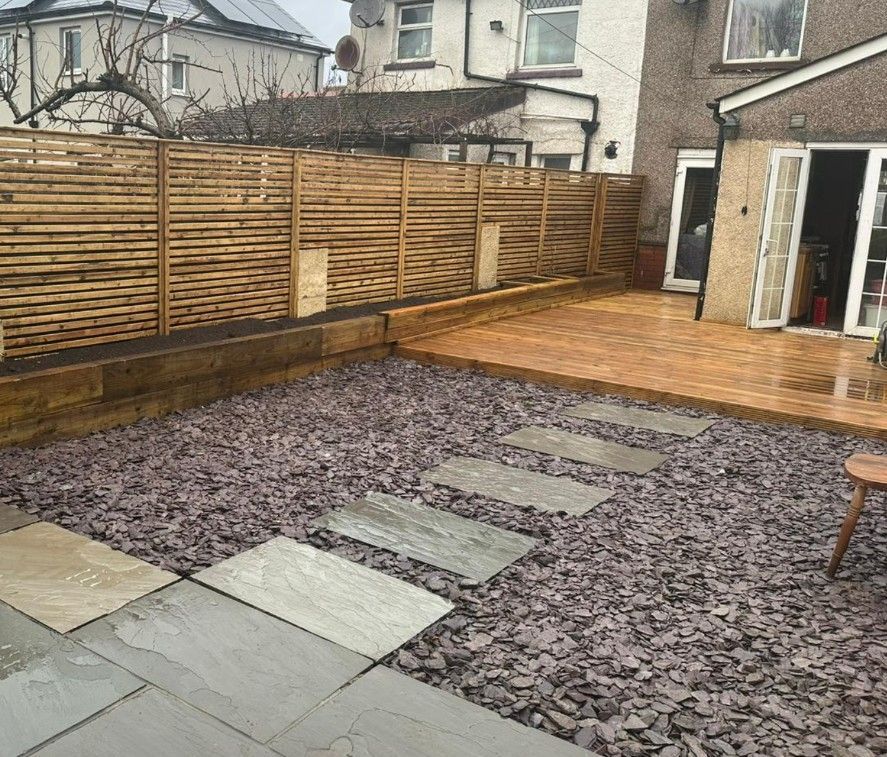 Wooden decking installation alongside fencing and landscaping in Cardiff by J&Z Fencing