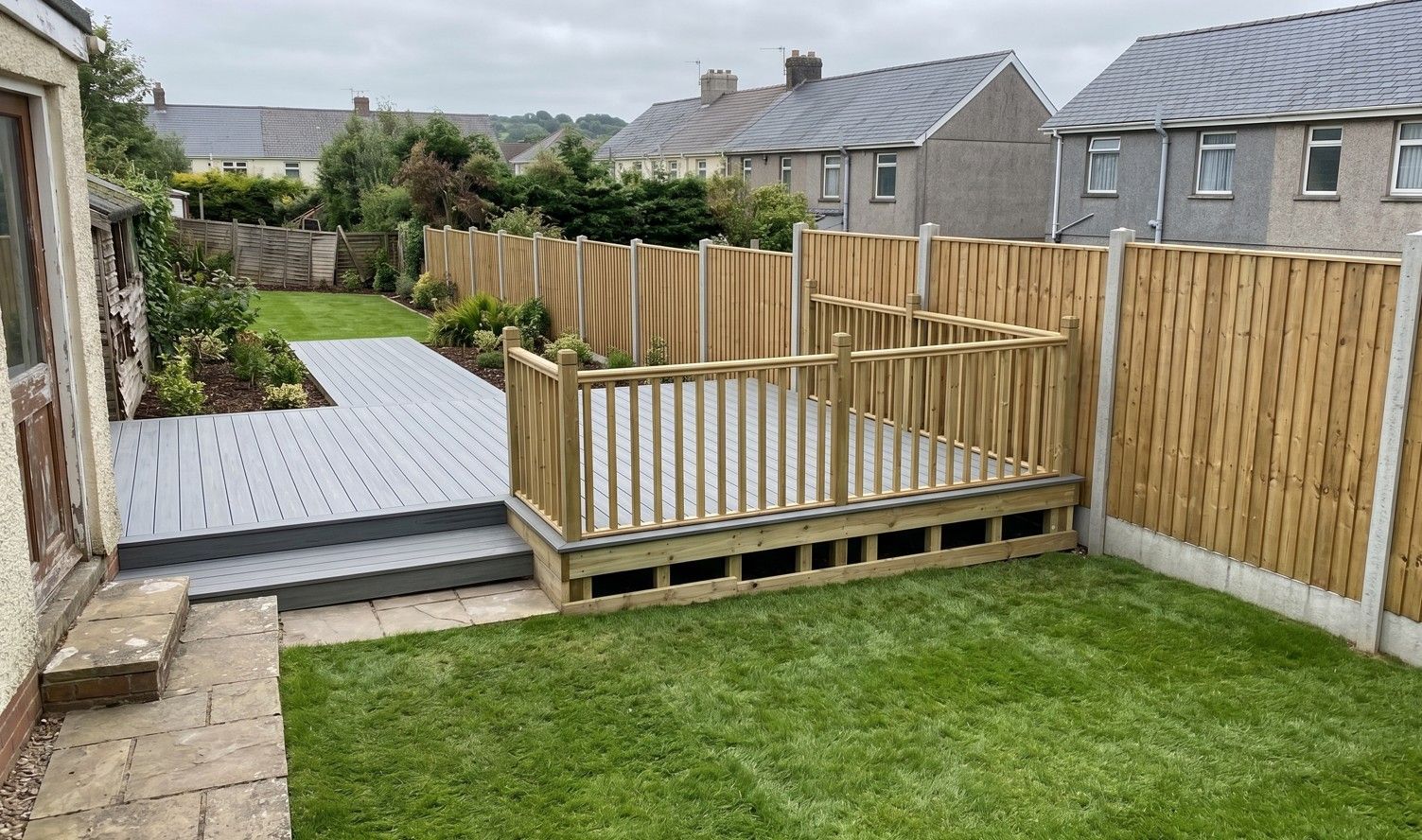 Completed composite decking and new garden fencing in Penarth, Cardiff by J&Z Fencing