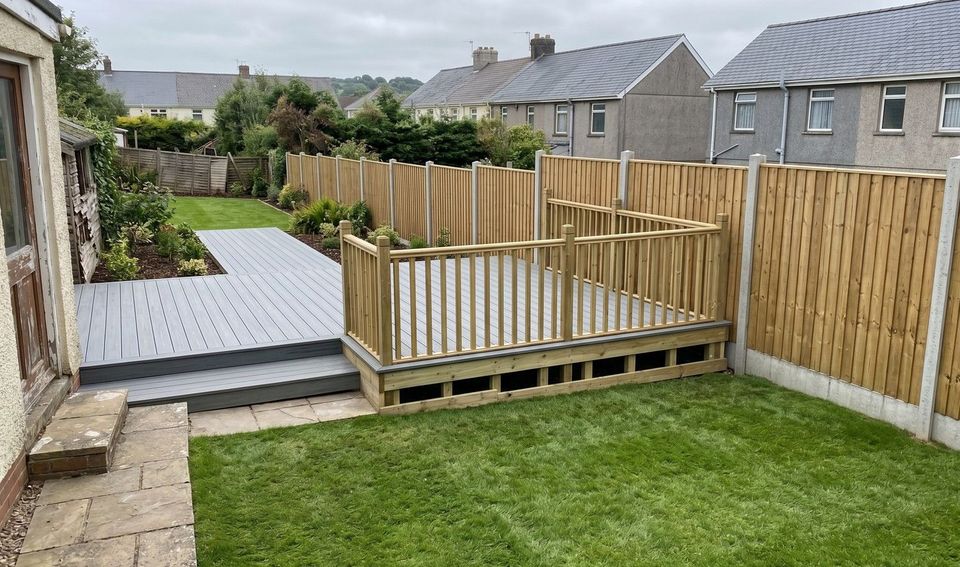 Back garden in Penarth with new timber fencing, grey composite decking and a lawn