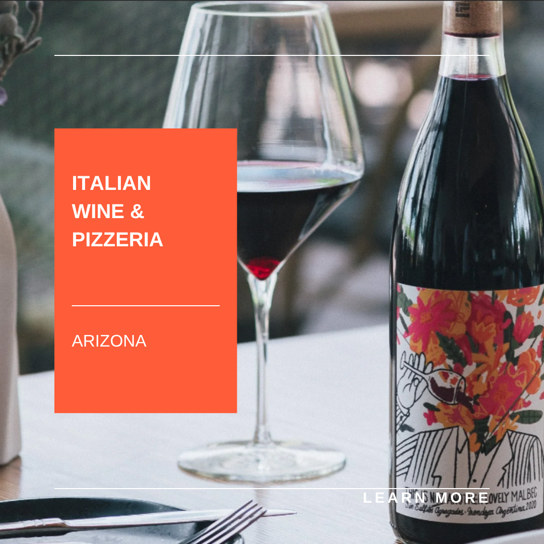 Italian wine and pizzeria sign beside a wine glass and bottle on a table